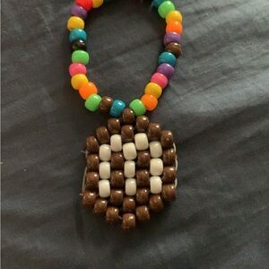 Colorful Beaded Bracelet with Brown and White Pendant